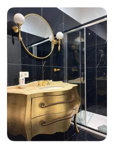 a bathroom with a sink and a mirror at Sanleucio SILK ROOM in Caserta +37 photos