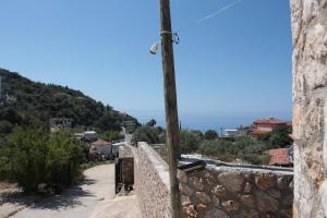 a view from the wall of a mountain at Agora Apartments in Dhërmi +19 photos