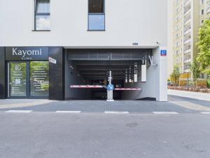 a view of a building with a parking garage at NanoApart by Solarento in Warsaw
