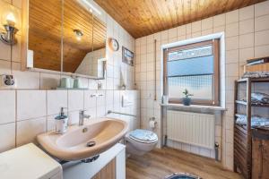 a bathroom with a sink and a toilet at Bassd scho in Ebensfeld +19 photos