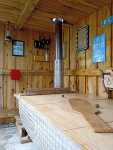 a room with a woodburning stove in a cabin at West Stable Cottage in Cameron +15 photos