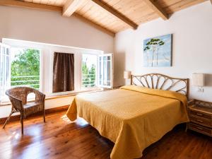 a bedroom with a bed and two windows at Hotel Club I Pini - Boutique Hotel & Residenza d'Epoca in Lido di Camaiore