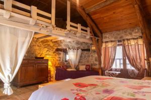 a bedroom with a bed in a room at L'echappée de la lozère in Les Laubies