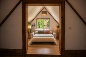 a bedroom with a bed and a window at Frein Chalets - Kaltenbach 1A in Frein
