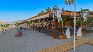 a building on the beach with a book store at World Star Beach Resort & Spa in Alanya