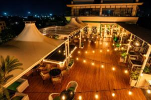 an aerial view of a deck at night with lights at Namastey Puri Hotel - Near Jagannath Dham Temple With Restaurant And Parking Facility Fully Air Conditioning Room in Puri