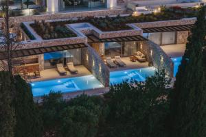 an aerial view of a building with a pool at Doci Kelios - Serenity Suites with Private Heated Pools, by ZanteWize in Agios Nikolaos