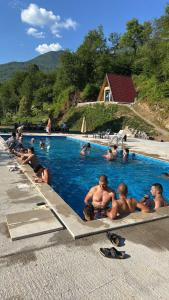a group of people in a swimming pool at Rafting Center "TARA-RAFT" in Bastasi