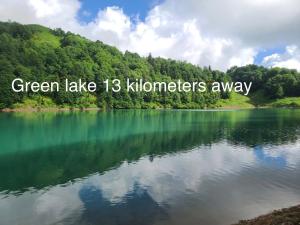 a lake with the words green lake kilometers away at Mountain View in Goderdzi
