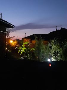 a car driving down a street at night at Stone House Rooms near Kavala in Amisianá +1 photo