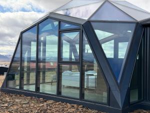 a glass house with a table in it at Hotel Stafholt in Varmaland +47 photos