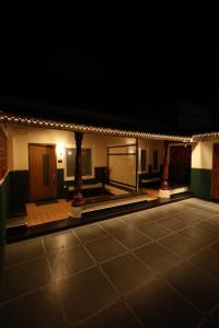 a view of a gymnasium lit up at night at David Residency in Madurai