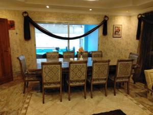 a dining room with a table and chairs and a window at Villa Marmara in Medina