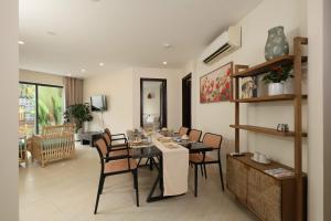 a dining room with a table and chairs at Cham Riverside in Thôn Xuân Lạc +21 photos