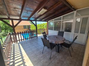 a patio with a table and chairs on it at Apartments Lukić in Soko Banja