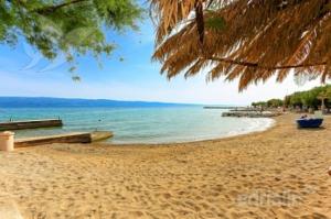 a sandy beach with a view of the ocean at Villa Nada - STUDIO 11 in Duće +13 photos