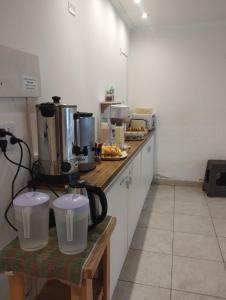 a kitchen with a counter top with appliances on it at Hotel Lobo de Mar in Mar del Plata
