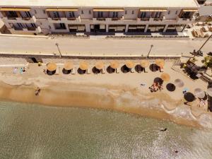 an aerial view of a beach with umbrellas at Armia Experience Hotel in Vári