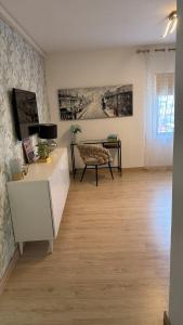 a living room with a couch and a table at CORNELIAS HOME 1A between LAS VISTAS & LOS CRISTIANOS BEACH in Los Cristianos