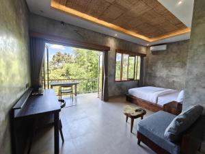 a bedroom with a bed and a desk and a table at Nawang Sakti in Ubud +62 photos