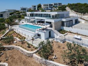 an aerial view of a house with a swimming pool at View Villas Collection in Vinišće