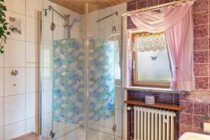 a bathroom with a shower and a window at Haus Elfriede Schmid in Bad Bayersoien +73 photos