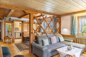 a living room with a couch and a table at Haus Elfriede Schmid in Bad Bayersoien