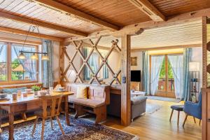 a living room with a table and a couch at Haus Elfriede Schmid in Bad Bayersoien