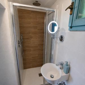 a bathroom with a shower with a toilet and a sink at Chalet Como Lake - Nature Retreat, foot access only in Griante Cadenabbia