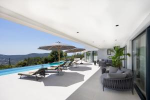 an external view of a house with a swimming pool at View Villas Collection in Vinišće