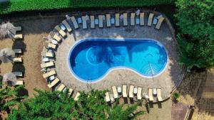 an overhead view of a swimming pool with chairs around it at Hotel Sunrise Golden Sands in Golden Sands +73 photos