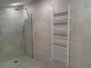 a bathroom with a shower with a glass door at Hamabi in Hendaye +31 photos