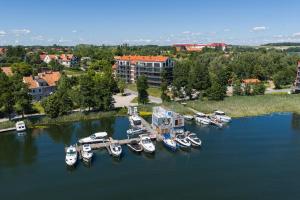 an aerial view of boats docked in a harbor at Lake Rental Spacerowa in Mikołajki