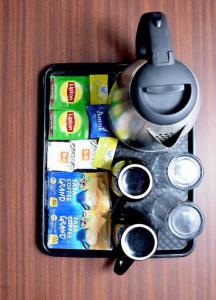 a case with some food and a pair of scissors at Hotel Ayodhya Palace - 400 Mtrs from HANUMAN GARHI in Ayodhya +13 photos