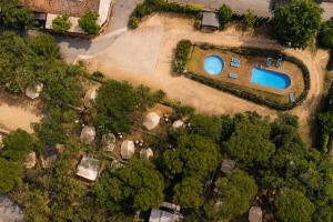 an overhead view of a house with a swimming pool at Kampaoh Calella de Palafrugell in Calella de Palafrugell
