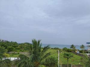 a view of the ocean from the balcony of a resort at SSS HOTEL in Trincomalee +31 photos