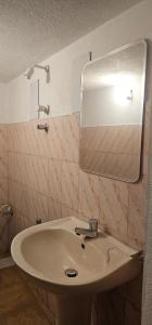 a bathroom with a sink and a mirror at VThree Hotel in Matara +35 photos