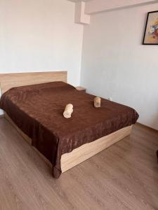 a bed with two wooden headboards on top of it at Very good location in Hunedoara +12 photos