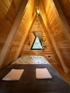 a bedroom in a tree house at TriView in Žabljak +49 photos