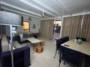 a living room with a couch and a table at Villa Dar La Belle Beyah - Tezdaine in Taguermess