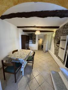 a dining room with a table and chairs at Al Castello in Valeriano Lunense +23 photos