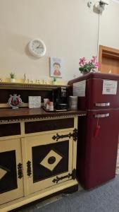 a kitchen with a red refrigerator next to a counter at Casa Elvezia Guest House in SantʼElpidio a Mare +35 photos