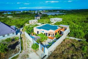 an overhead view of a house with a blue roof at Matemwe Bluu Villa in Matemwe