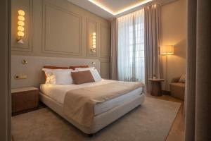 a bedroom with a large bed and a window at The Book Hotel in Horta +47 photos
