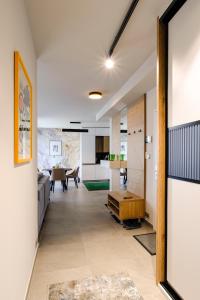 a hallway with a living room and a dining room at Victory port Apartmán in Liptovský Mikuláš