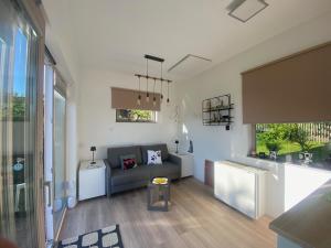 a living room with a couch and a table at Tiny House 47 in Egloffstein