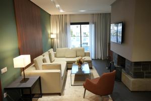 a living room with a couch and a fireplace at ZEPHYR Ifrane in Ifrane