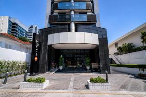 a building with a staircase leading up to it at Intercity Interative São Paulo Jardins in São Paulo