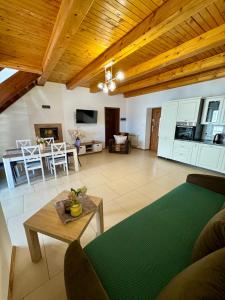 a living room with a couch and a table at Pod skrzydłami IV in Miłomłyn