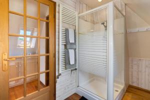 a walk in shower with a glass door at Les Temps Des Sources in Veyrines-de-Domme +54 photos